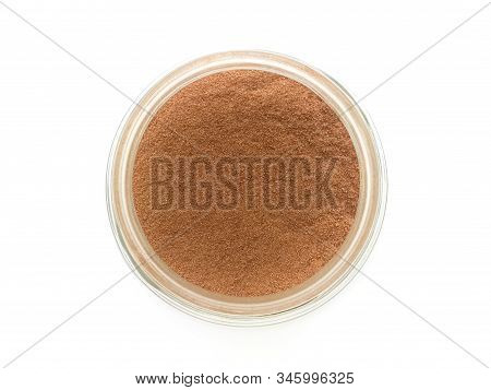 Cocoa In A Glass Bottle Top View On White Background
