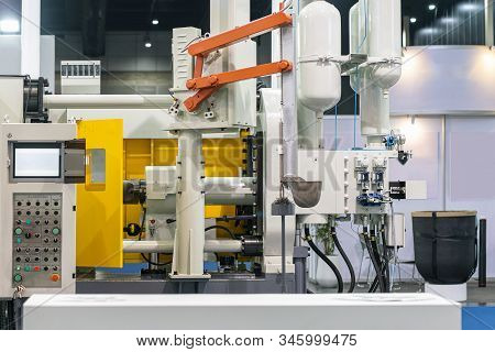 Close Up Ladle & Mechanical Arm Of Automatic High Pressure Aluminum Die Cast Machine & Air Tank Hydr