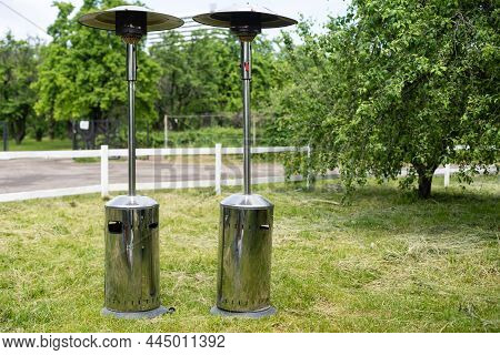 Gas Outdoor Heater Working On Terrace. Steel Metal Warming Device.