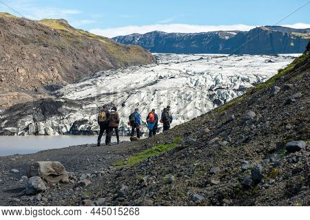 Tourists Hiking At Solheimajokull Glacier, Iceland