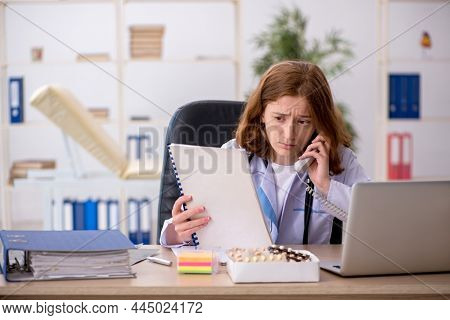 Young female doctor workiing in the clinic