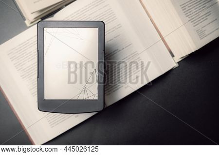 E Reader. Digital E Book, Library Reader Tablet With Books On Dark Background. Online Education Cour