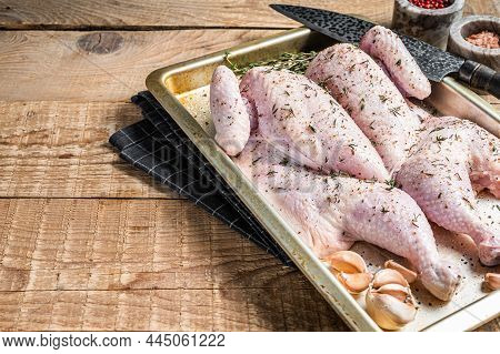 Cooking Raw Spatchcocked Whole Chicken With Garlic And Thyme In Baking Dish. Wooden Background. Top 