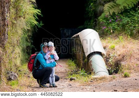 Mother And Daughter Posing At Tunnel Entrance Before Going Through The Mountain.