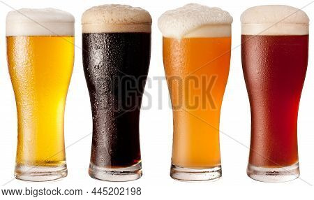 Four Glasses With Different Beers On A White Background. The File Contains A Path To Cut.