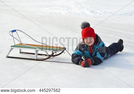 Caucasian Child In Winter Clothing Playing Outdoors