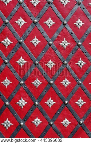 Medieval Red Door With Diagonal Iron Stripes And Silver Stars