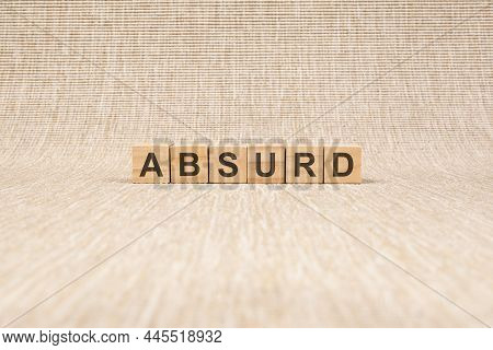 Word Absurd Made With Wood Building Blocks, Stock Image, Brown Background