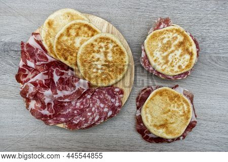 Delicious Italian Tigelle On Wooden Background. Traditional Dish From Emilia-romagna Region. View Fr