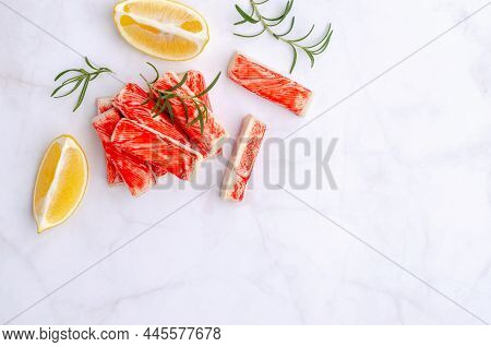 Crab Meat Sticks With Lemon And Rosemary. Top View. Selective Focus.