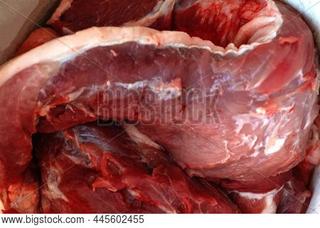 Defocus Texture Or Background Of Tasty Fresh Meat Of Big, Pork. Red Beef Meat Close Up Texture. Meat