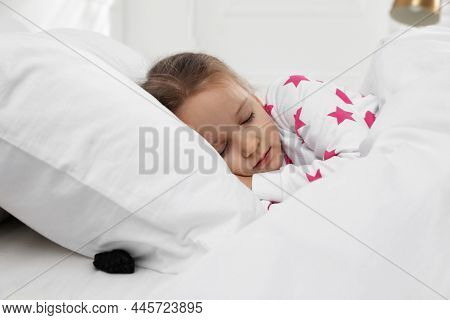 Cute Little Girl Sleeping In Bed, Piece Of Coal Under Pillow. Saint Nicholas Day Tradition