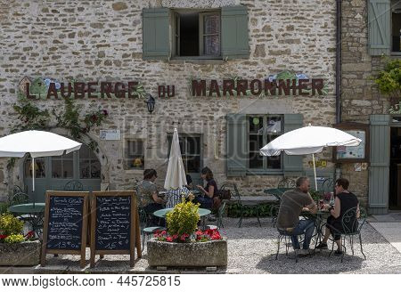 Chateauneuf, France - July 7, 2020: Terrace In The Village Of Chateauneuf With People Drinking And E