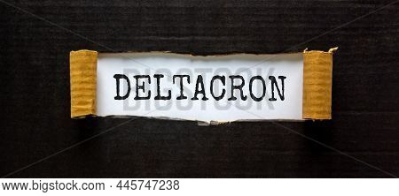 Covid-19 Corona Deltacron Symbol. The Concept Word Deltacron Appearing Behind Torn Black Paper. Beau