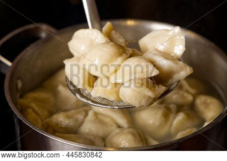 Serving Dumplings Rto Plate. Bowl Of Tasty Dumplings Served.
