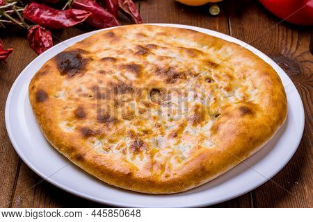 Kubdari With Meat On Wooden Table Side View