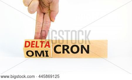 Covid-19 Omicron Or Deltacron Symbol. Doctor Turns A Cube And Changes The Word Omicron To Deltacron.