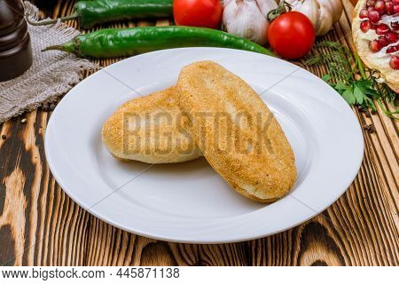 Mchadi Georgian Cuisine On Wooden Table Side View