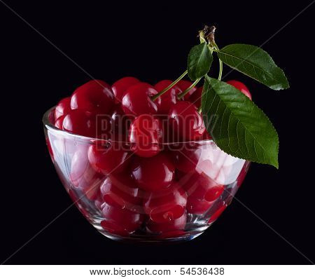 Close-up Of Wet Cherries In Glass Bowl On Dark