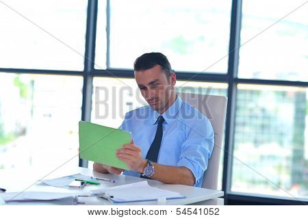 close-up of human hand  business man using tablet compuer at office
