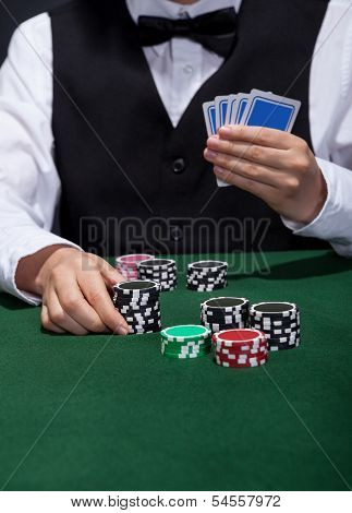 Poker Player About To Place A Bet
