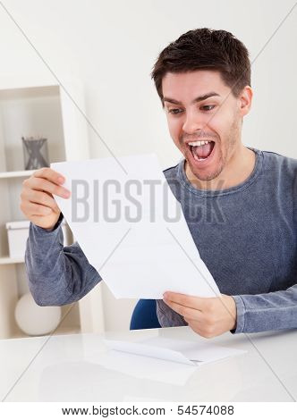 Exultant Young Man Cheering Good News
