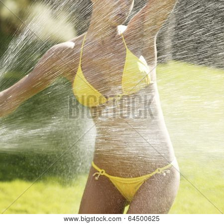 Spray Water On A Female Body With Bikini