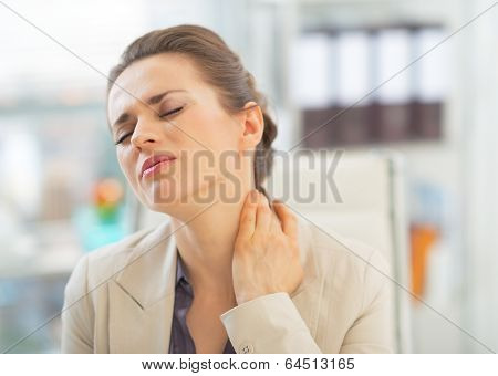 Portrait Of Business Woman With Neck Ache