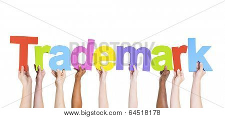 Multiethnic Group of Hands Holding Trademark