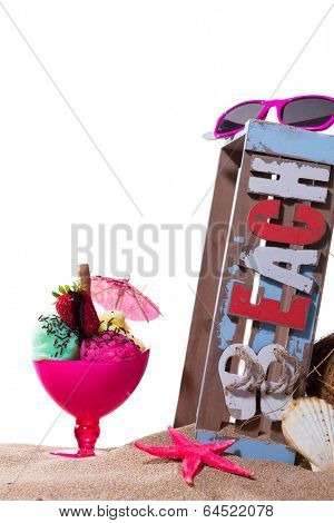 Gourmet tropical icecream dessert served alongside a sunny summer beach in an elegant dish