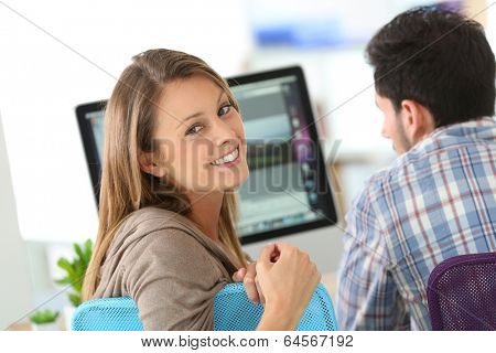 Business people meeting in front of desktop