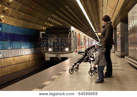 Mother With Son At Subway Station