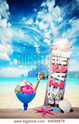 Gourmet tropical icecream dessert served alongside a sunny summer beach in an elegant dish