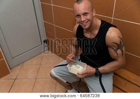 Bodybuilder Eating Healthy Diet Food Out Of Tupperware