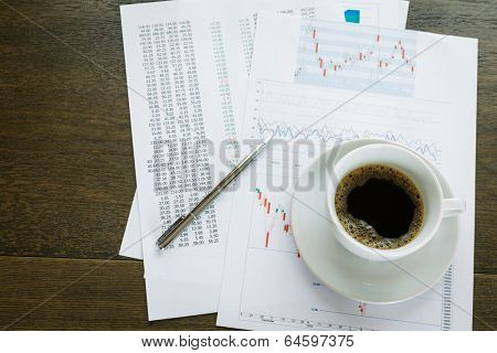 Coffice cup and financial documents