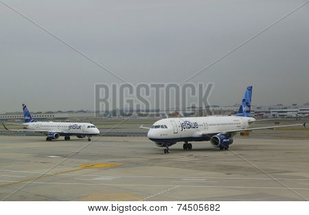 JetBlue Airbus aircrafts taxing at John F Kennedy International Airport in New York