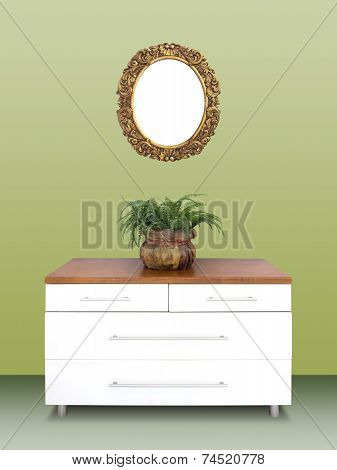 Modern Chest Of Drawers And Gilded Frame On Wall