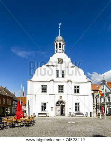 WOLGAST, GERMANY - JUNE 4, 2015:  famous historic town hall facade in Wolgast under blue sky