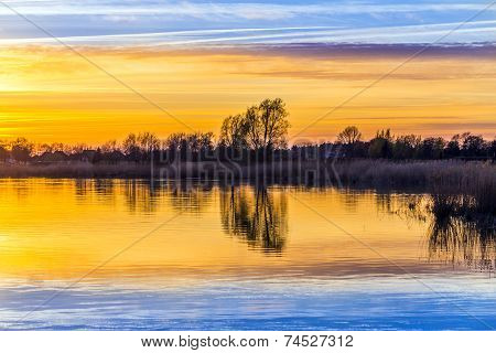 Sunset In Zinnowitz With Reflection On The Water