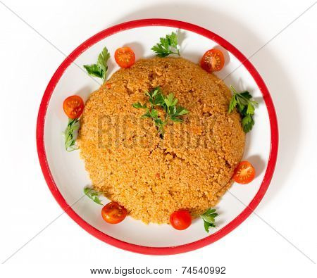 turkish bulgur pilaf made with bulgur, or burghul, wheat, onion, capsicum, and tomato, This is a staple of Turkish cuisine.