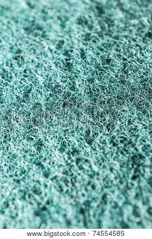 Close-up Of A Green Cleaning Sponge Surface As A Backdrop Background Texture