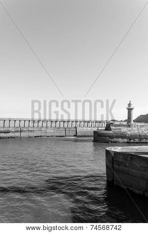 Scenic view of Whitby Pier in sunny autumn day, UK