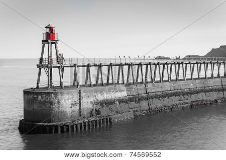 Scenic view of Whitby Pier in sunny autumn day, UK
