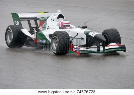 ASSEN, NETHERLANDS - OCTOBER 19, 2014: Team Mexico's car racing on a wet TT circuit during the final race of the acceleration FA1 Grand Prix European Circuit.