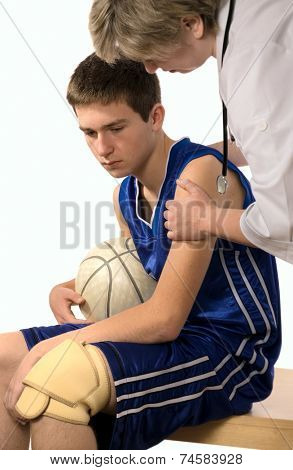 doctor giving first aid the hurt sportsman
