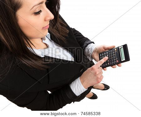 Businesswoman holding calculator and pressing a button