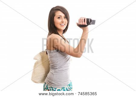 Young cute tourist with video camera