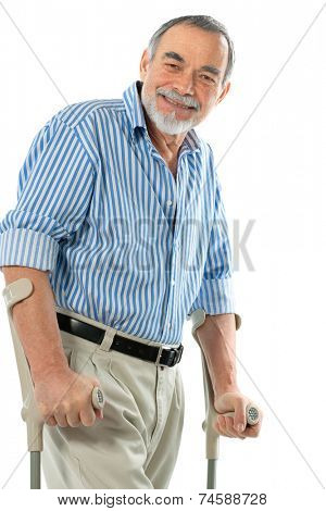 senior man on crutches smiling