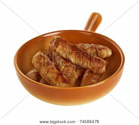 Sausages Wrapped In Bacon In A Frying Pan, Chevapchichi On White Background
