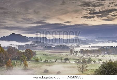 Hilly Landscape With Fog